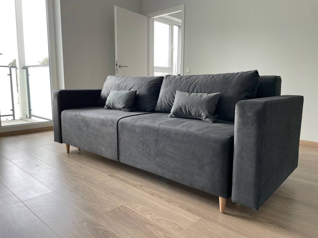 Straight sofa, dark grey fabric, wooden legs